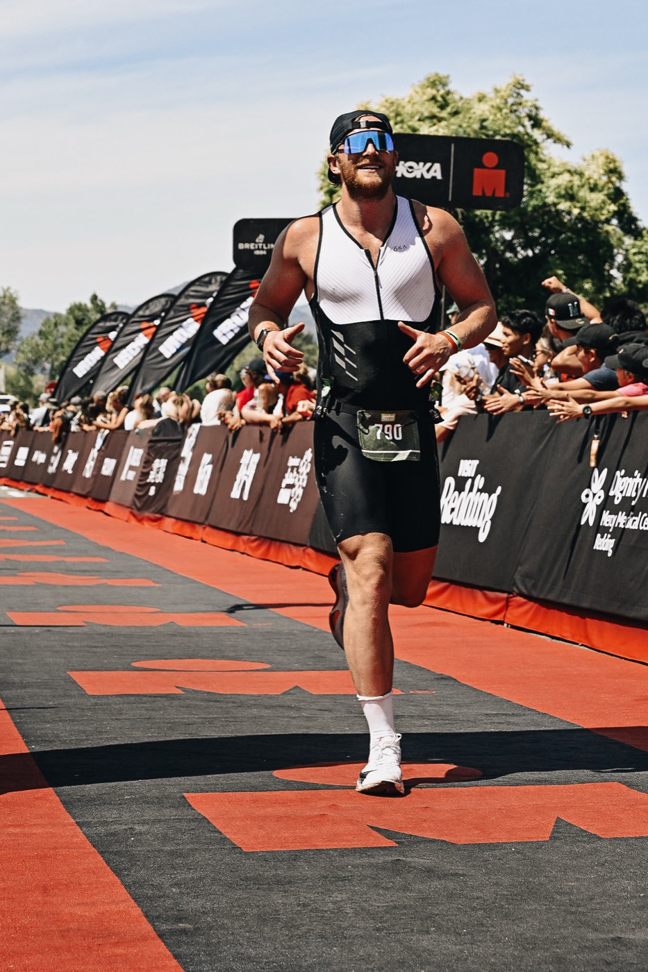 Mitchell McCullough running the finish chute at IRONMAN 70.3 Northern California